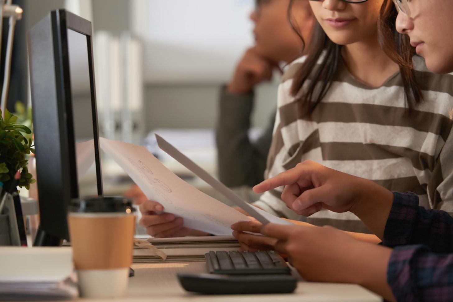 Students engaged in collaborative financial analysis workshop